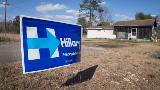 A Hillary Clinton sign sits in a yard.