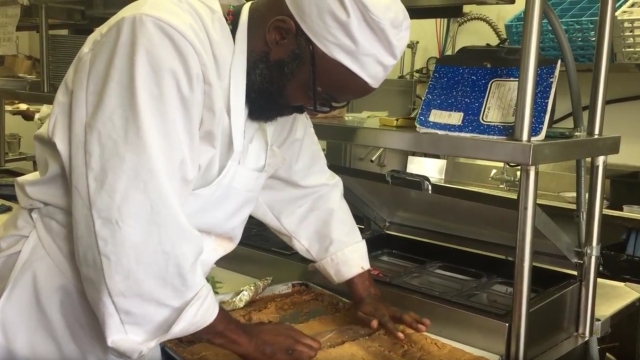 A line cook prepares food at Edwins Leadership and Restaurant Institute, which employs former inmates.