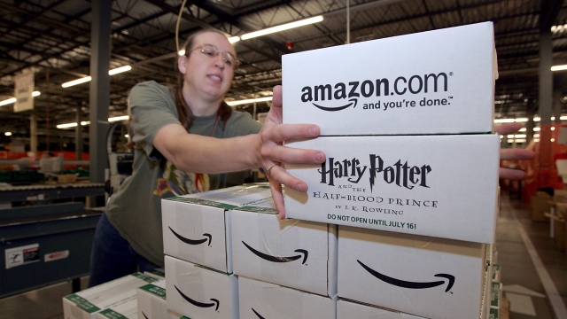 Amazon worker Jennifer Bladow moves pre-packaged copies of "Harry Potter and the Half-Blood Prince."