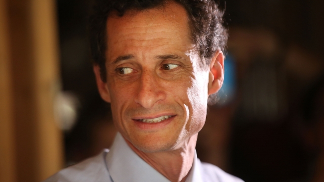 Anthony Weiner glances to his right.