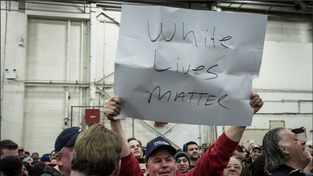 A Trump supporter holds up a 'White Lives Matter' sign during a rally for Republican Presidential Candidate Donald Trump.