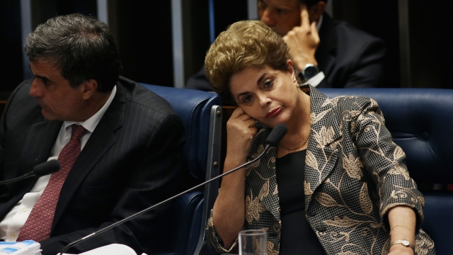 Brazilian President Dilma Rousseff rests her head in her hand during her impeachment trial Aug. 29, 2016.