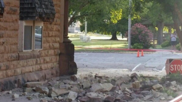 Stones from a building lie crumbled on a sidewalk following an earthquake that struck Oklahoma.