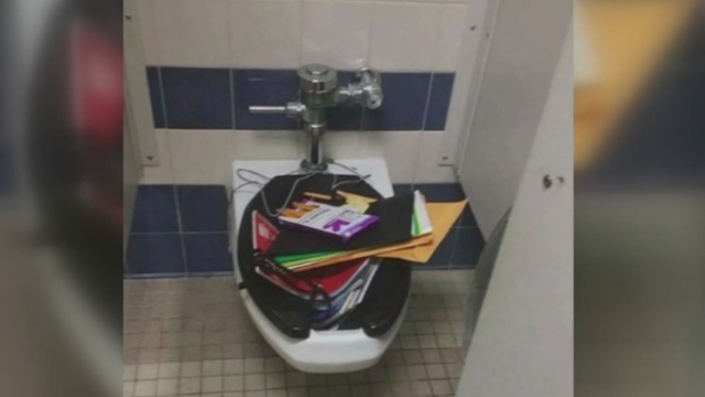 Alex Hernandez's belongings stuffed into a school toilet.