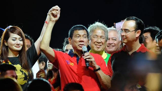 Rodrigo Duterte gestures during his final campaign rally.