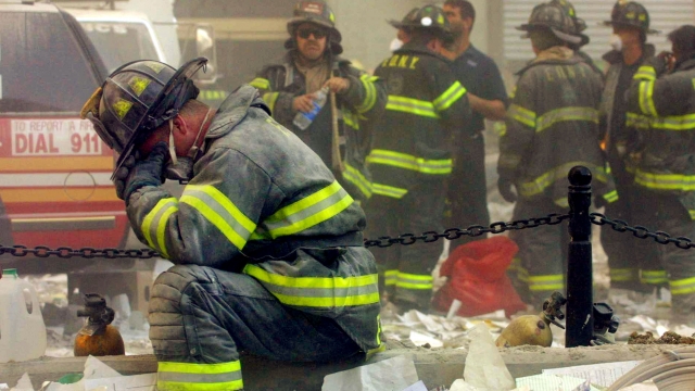 A firefighter breaks down after the World Trade Center buildings collapsed Sept. 11, 2001.