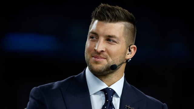 Broadcaster Tim Tebow of the SEC Network speaks on air before the Goodyear Cotton Bowl at AT&T Stadium in 2015.