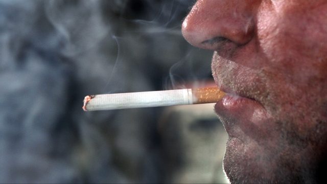 A man smokes a cigarette.