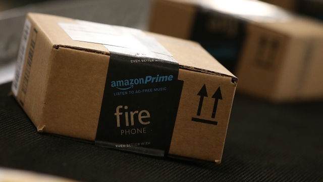 Boxes move along a conveyor belt at an Amazon fulfillment center.