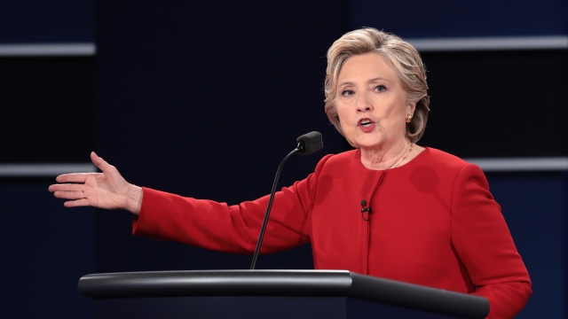 Clinton gestures toward Trump at the debate