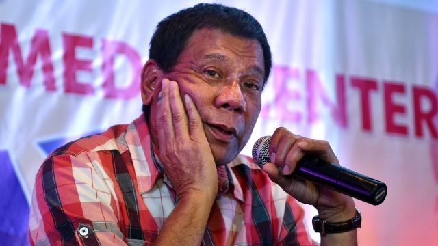 Rodrigo Duterte answers questions from journalists during a press conference.
