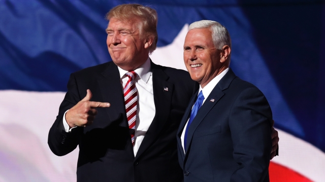 Republican presidential candidate Donald Trump stands with Republican vice presidential candidate Mike Pence.