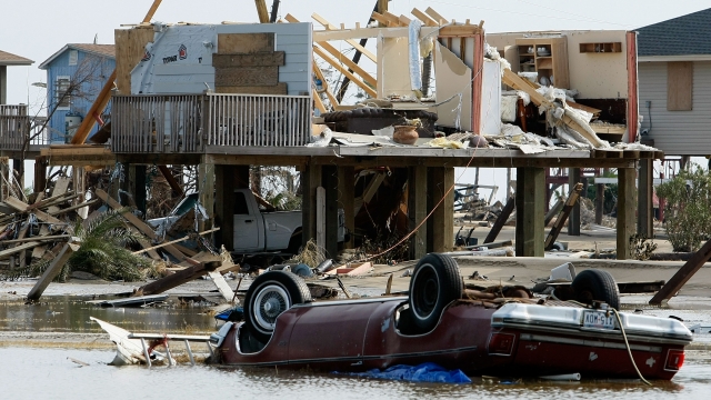 A home and a car lie destroyed by Hurricane Ike.