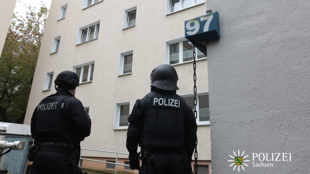 German police officers searching for the bombing plot suspect