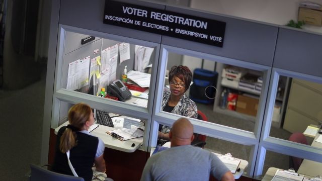 A voter registration sign hangs at the Miami-Dade Election Department