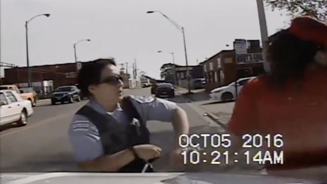 A Chicago police officer struggles with a man before he attacks her.