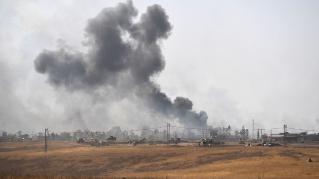 Smoke billows from a combined aircraft, artillery and ground attack to recapture the village of Tiskharab from ISIS.