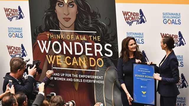 Two actresses and a Wonder Woman sign