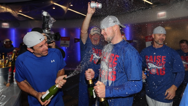 Cubs pitcher Jon Lester and his teammates spray champagne on each other after their NLCS win.