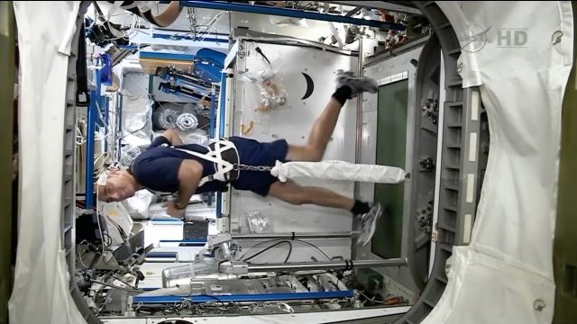 An astronaut on a space treadmill.