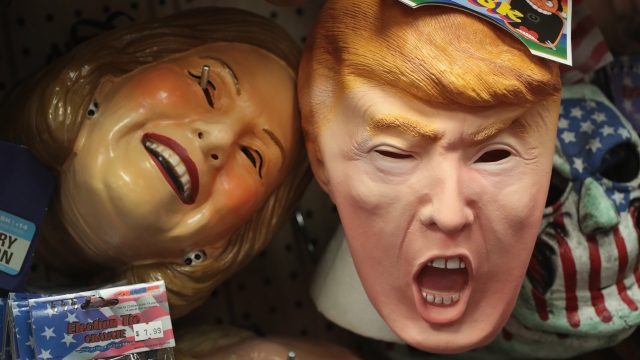 Hillary Clinton and Donald Trump masks on display at a store.