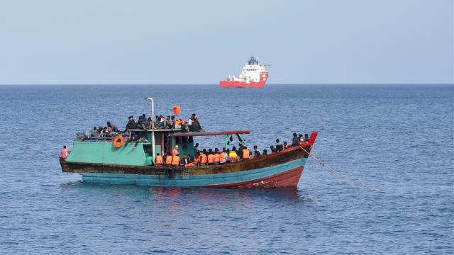 Suspected asylum-seekers arrive at Christmas Island after receiving assistance by Australian Navy.