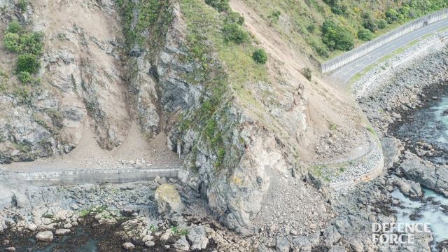 A landslide in New Zealand blocks a coastal road after a 7.8 magnitude earthquake.