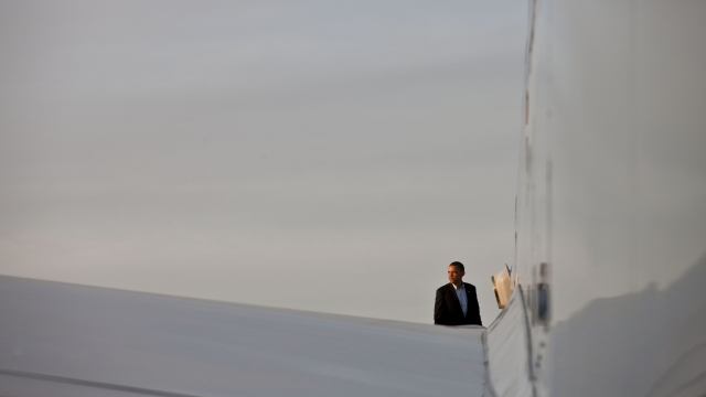President Barack Obama boards Air Force One.