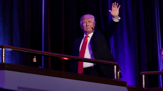 Presumptive President-elect Donald Trump waves to a crowd