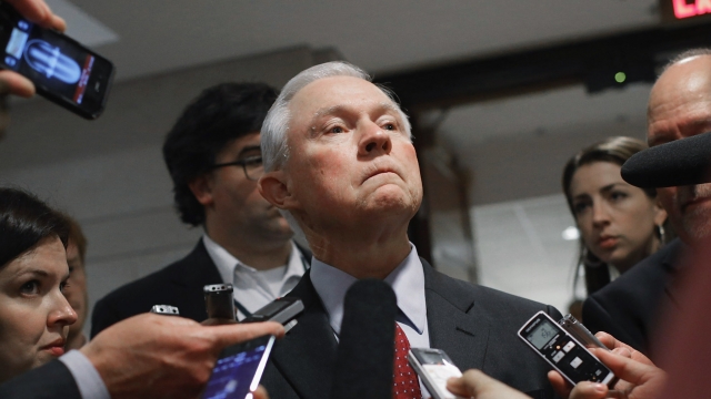 Sen. Jeff Sessions talks with reporters.