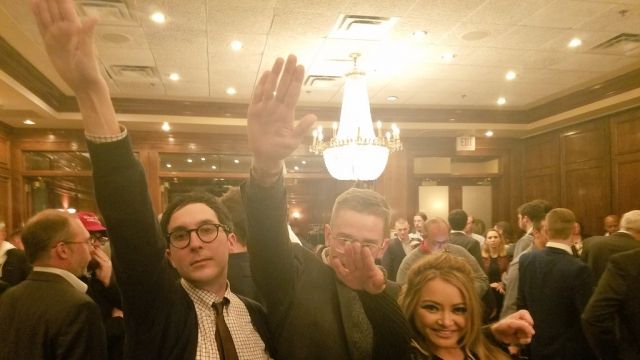 People allegedly performing a "heil Hitler" salute.