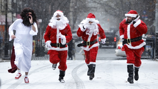 Santas run in the snow