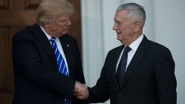 President-elect Donald Trump shakes hands with retired United States Marine Corps general James Mattis.