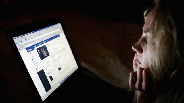In this photo illustration, a girl browses the Facebook social networking site.