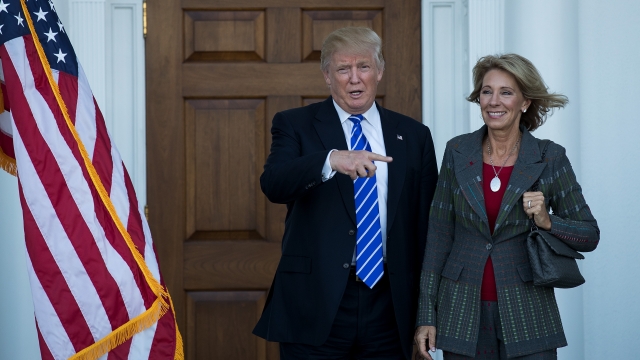 Donald Trump and his pick for education secretary Betsy DeVos