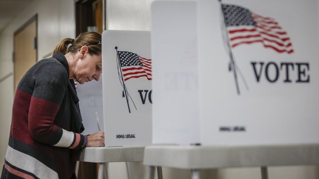Woman fills out ballot