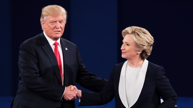 Donald Trump and Hillary Clinton shake hands after second presidential debate.