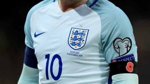 An English national team player wearing a poppy armband.