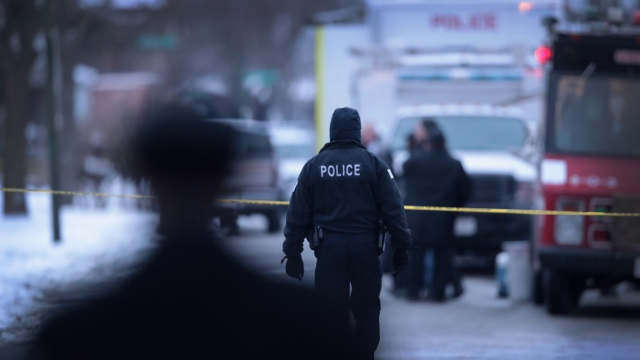Police investigate the scene of a quadruple homicide on Chicago's Southside.
