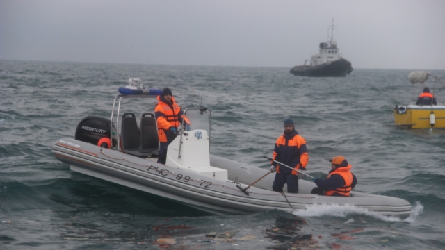 Russian search crews in boats