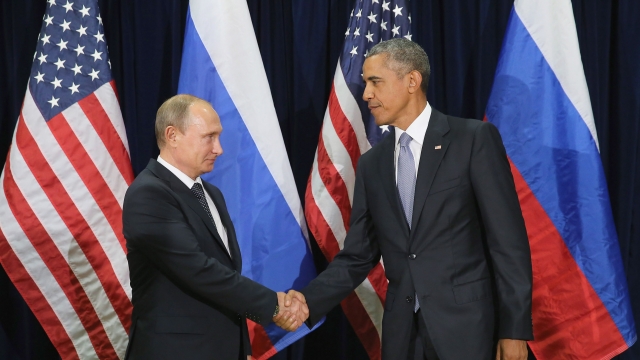 Russian President Vladimir Putin and U.S. President Barack Obama shake hands.