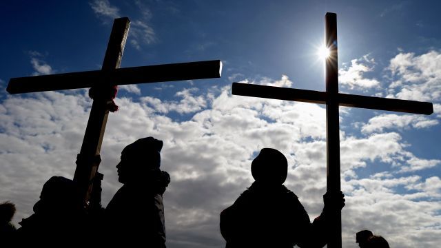 People holding crosses