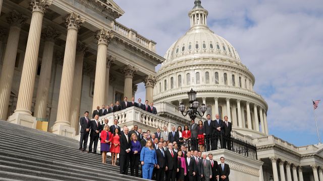 Incoming members of Congress pose on the steps of the Capitol