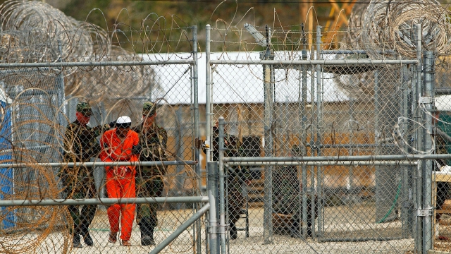 Marines transport a detainee in Guantanamo Bay, Cuba.