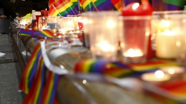 Candles are lit during a vigil for the victims of the Pulse Nightclub shooting in Orlando.