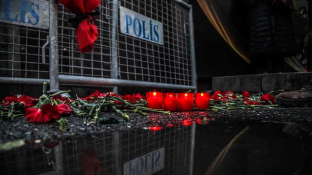 Flowers and candles are placed outside the Reina nightclub in Istanbul.