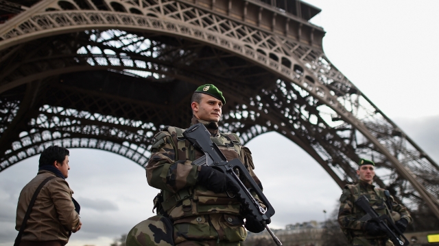 A French solider in front of the Eiffel Tower in Paris, France.