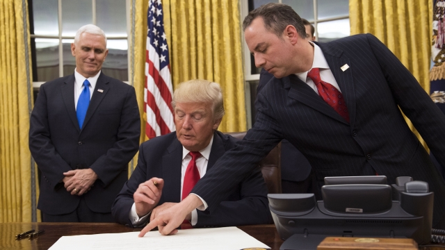 President Donald Trump prepares to sign a measure.