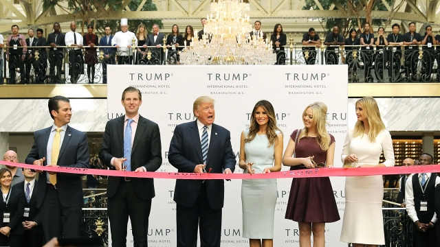 Donald Trump and his family cut the ribbon at the new Trump International Hotel.