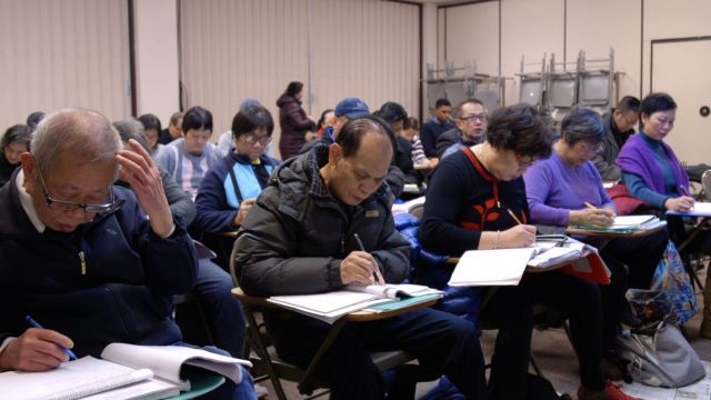 Chinese immigrants in Chicago's Chinatown participate in a citizenship class.